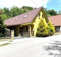 A family house in Bartošova Lehôtka with two floors and a garden, surrounded by greenery.