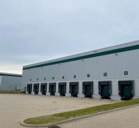 Warehouses and halls in Galanta with loading ramps and paved area.