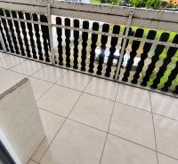 Balcony with ceramic tiles and railing, overlooking the garden in Krásno nad Kysucou.