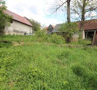 Construction of houses on Matúšovská Street in Žaškov with old buildings and greenery.