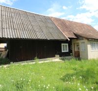 An older house with a metal roof on Matúšovská Street in Žaškov, surrounded by grass.