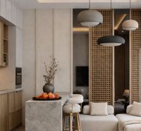 Interior of a 1-room apartment with a kitchen, light shades, and decorations.