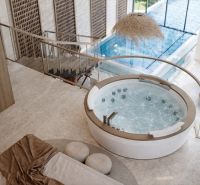 Interior with a hot tub and a view of the pool in a 4-room apartment.