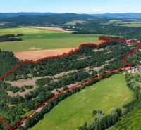 Aerial view of agricultural and forest land surrounded by nature near the village of Domaníky.