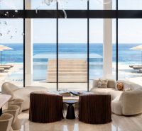 Luxury living space in a 5 or more bedroom apartment with an ocean view.