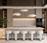 A kitchen in a 5 or more room apartment with an island and lighting.