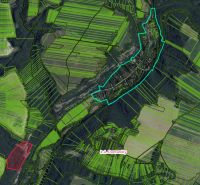 Aerial view of agricultural and forest land around the village of Domaníky.