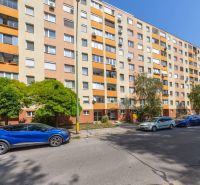 Apartment building on Švabinského Street in Bratislava - Petržalka with cars and greenery.