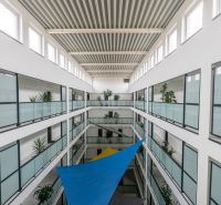 A device with glass railings and plants in the interior, ideal for a 2-room apartment.