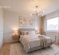 Bedroom in a two-room apartment, bed with a blanket, wooden decor flooring, large window.