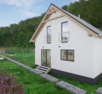 A family house with a simple design surrounded by a garden and flower beds in Kostiviarska, Banská Bystrica.