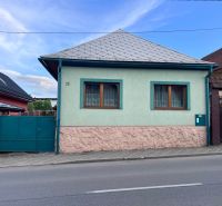 A family house in Ružomberok on Kalvárska Road with two windows and a metal roof.