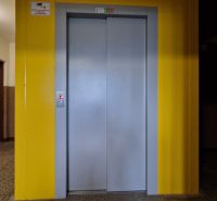 Hallway in a panel building with an elevator on Karola Kuzmányho Street in Kežmarok.