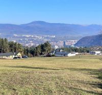 Panorama of Banská Bystrica from the Pršianska road, Residential plots, with a mountain backdrop.