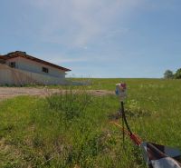 Building and green field in the village of Lietavská Svinná-Babkov suitable for residential plots.