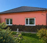 The family house on Nova Cesta in Jelka, Galanta district, has a pink facade and a tiled roof.