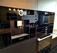 Bosch kitchen appliances in a family house with a wooden decor floor.