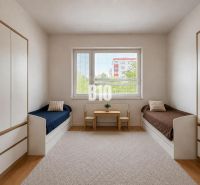 A children's room in a two-room apartment with two beds, a table, and storage space.