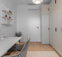 A study in a 3-room apartment with storage space, a desk, and decorative elements.