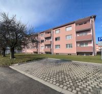 Apartment building with trees and parking on Dukelských hrdinov Street, Žiar nad Hronom.
