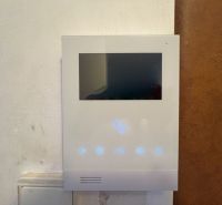 Interior touch panel with display, likely for a video intercom in a 2-room apartment.