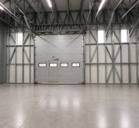 Spacious production facilities with concrete floors and steel structures.