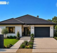 A family house with a garden in Jur nad Hronom, suitable for residential plots.