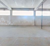 Warehouses and halls with concrete floors and skylights on the walls.