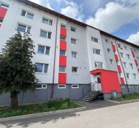 Apartment building on Za Nožiarňou Street, Slovenská Ľupča, with distinctive red panels.