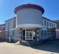Building with an arched entrance in Kremnička, Banská Bystrica, serving as warehouses and halls.