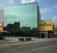 Shopping center with a glass facade on Robotnícka Street in Banská Bystrica, Banská Bystrica District.