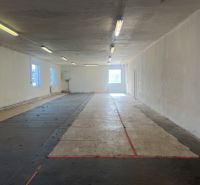 Empty interior room in warehouses and halls with concrete flooring and lighting.