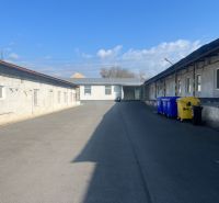 Exterior Warehouses and halls with colorful containers in Banská Bystrica, Cementárenská cesta.