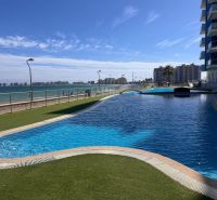 A pool with a sea view at the Holiday Apartment in La Manga del Mar Menor, Spain.