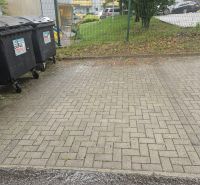 Trash bins on Kvačalova Street in Žilina behind the fence of a 3-room apartment.