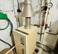 Heating in the utility room of a 3-bedroom apartment with wiring and piping on the walls.