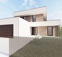 Family house in Sliač, residential plots with wood decor and a garage.