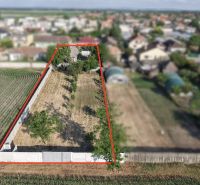 Aerial view of the property and family house in Nesvady with a rural setting.