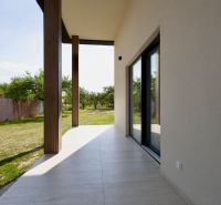 The terrace of a family house in Zemplínska Široká with a view of the landscaped garden.