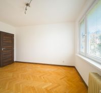 A room in a 3-room apartment with a wood-patterned floor and large windows.