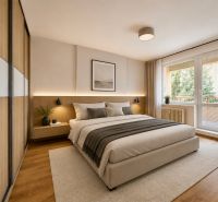 A bedroom in a three-room apartment with a bed, a large window, and a floor with a wooden decor.