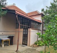 A family house in Dulovce with a terrace, garden, and traditional pitched roof.