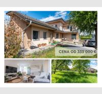 A family house in Prešov with a garden and a living room with a wooden decor floor.