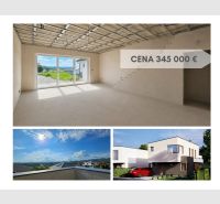 Interior of a family house with large windows and a view of Prešov. Price: €345,000.