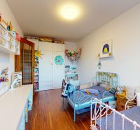 Children's room in a 3-room apartment with a wooden decor floor.