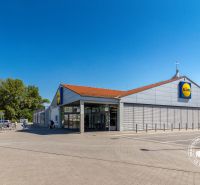 Lidl store in Bratislava - Petržalka, Vígľašská, with a parking lot and customers.