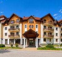 A multi-story building with wooden balconies in the city of Bratislava - Petržalka on Antolská.