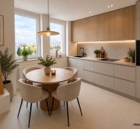 The kitchen in a 2-room apartment with a dining table and a view from the window.