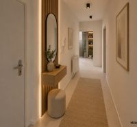 A hallway in a 2-room apartment with a backlit mirror and wooden decor.