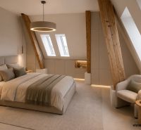An attic bedroom with wooden elements and a comfortable armchair in a two-room apartment.